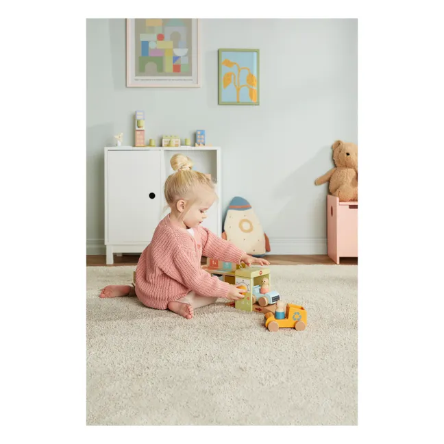 Girl playing in her playroom with building blocks in Toronto