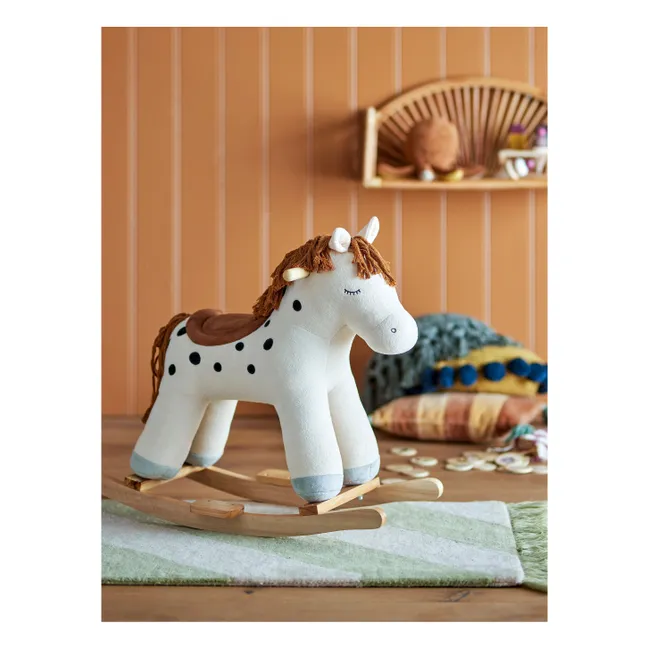 Kids riding horse toy in a Toronto playroom